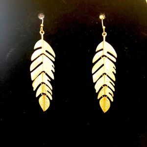 Gold tone leaf design earrings.